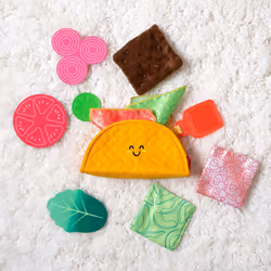 Melissa & Doug Multi-Sensory Soft Taco Fill & Spill Infant Toy