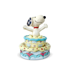 Enesco 6005944 Peanuts by Jim Shore Snoopy Jumping Out of Birthday Cake Figurine  5.5 Inch  Multicolor