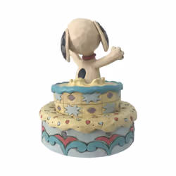 Enesco 6005944 Peanuts by Jim Shore Snoopy Jumping Out of Birthday Cake Figurine  5.5 Inch  Multicolor
