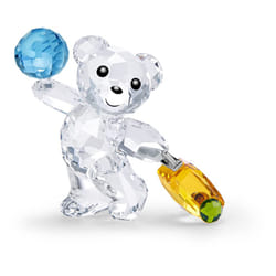 SWAROVSKI Kris Bears I Travel the World Figurine  Clear Swarovski Crystal with a Green  Blue  and Yellow Accents  Part of the Swarovski Kris Bears Col