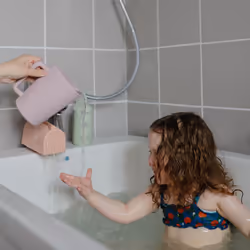 mushie Bath Spout Cover | Soft Silicone Bathtub Faucet Safety Guard for Kids | Universal Fit Blush