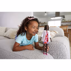 Barbie The Doctor Doll wears a print dress and doctor coat, with a stethoscope accessory. Great gift for ages 3+.