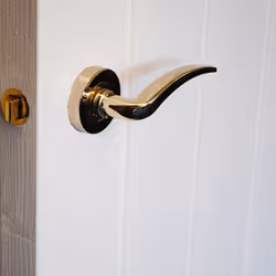 VIBE Design Corsica Lever on Rose Door Handle - Polished Brass