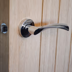 VIBE Design Twirl Lever on Rose Door Handle - Polished Chrome