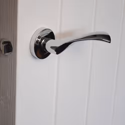 VIBE Design Twirl Lever on Rose Door Handle - Polished Chrome