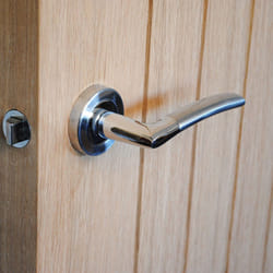 ViBE IOS Lever on Rose Door Handle in a Dual Finish