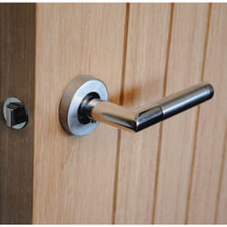 ViBE Dubel Lever on Rose Handle in a Dual Finish