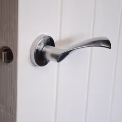 VIBE Design Twirl Lever on Rose Door Handle - Satin Chrome