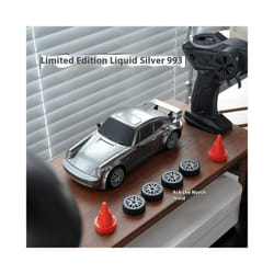 1/20 Scale 4WD Remote Control Drift Car RTR â High Performance Powerful Full Throttle RC Vehicle with - FQD13 with roadblock